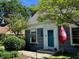 Close up of home's bright blue front door and landscaped yard at 5889 Crestview Ave, Indianapolis, IN 46220