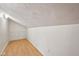 Finished attic space with vinyl floors and storage racks at 604 Alexandria Pike, Anderson, IN 46012