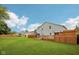 Extensive backyard with a large deck, gazebo, shed, and lush lawn, perfect for outdoor enjoyment at 604 Alexandria Pike, Anderson, IN 46012
