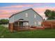 Beautiful backyard at dusk with a large wooden deck and gazebo for relaxation and enjoyment at 604 Alexandria Pike, Anderson, IN 46012