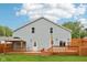 Spacious backyard featuring a large deck, gazebo, and well-maintained lawn, ideal for outdoor activities at 604 Alexandria Pike, Anderson, IN 46012