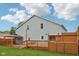 Large backyard featuring a spacious wooden deck and gazebo, perfect for outdoor entertaining at 604 Alexandria Pike, Anderson, IN 46012