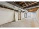 Unfinished basement with concrete walls and exposed pipes offers potential for customization at 604 Alexandria Pike, Anderson, IN 46012