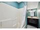 Full bathroom showcasing a tub, tiled floors, and an updated vanity with a sink at 604 Alexandria Pike, Anderson, IN 46012