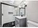 Modern bathroom with a stylish vanity, sleek fixtures, and a walk-in shower, creating a spa-like experience at home at 604 Alexandria Pike, Anderson, IN 46012