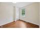 Cozy bedroom with hardwood floors, natural light, and a closet, offering a comfortable and inviting retreat at 604 Alexandria Pike, Anderson, IN 46012