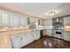 Well-equipped kitchen featuring stainless steel appliances, updated cabinets, and stylish tile backsplash, a chef's delight at 604 Alexandria Pike, Anderson, IN 46012