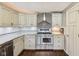 Beautiful kitchen boasts stainless steel appliances, granite countertops, and ample cabinet space for convenient storage at 604 Alexandria Pike, Anderson, IN 46012