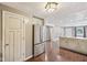 Open-concept kitchen seamlessly integrates with the living area, featuring stainless steel appliances and a center island at 604 Alexandria Pike, Anderson, IN 46012