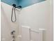 Simple shower with white surround and modern matte black shower head and fixture at 604 Alexandria Pike, Anderson, IN 46012