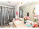This bathroom features a silver shower curtain, stylish vanity, and bright mirror at 6553 Black Antler Dr, Indianapolis, IN 46217
