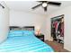 Cozy bedroom with a ceiling fan, nightstand, and closet at 6553 Black Antler Dr, Indianapolis, IN 46217