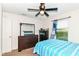 This bedroom features a window, dresser, and a ceiling fan at 6553 Black Antler Dr, Indianapolis, IN 46217