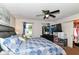 Bright bedroom features a ceiling fan, blue accents, and closet at 6553 Black Antler Dr, Indianapolis, IN 46217