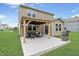 Spacious backyard patio features an outdoor kitchen and a pergola creating a relaxing entertainment area at 6917 Wolf Creek Ct, Whitestown, IN 46075