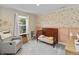 Cozy Bedroom has floral wallpaper, neutral carpet, rocking chair, and wooden crib at 6917 Wolf Creek Ct, Whitestown, IN 46075