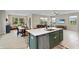 Open kitchen view to the dining and living area with a kitchen island featuring a stainless steel dishwasher at 6917 Wolf Creek Ct, Whitestown, IN 46075