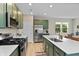 Well-equipped kitchen with stainless steel appliances, ample counter space, and an open layout at 6917 Wolf Creek Ct, Whitestown, IN 46075