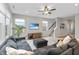Spacious living room featuring a large sectional couch, wood floors and recessed lighting at 6917 Wolf Creek Ct, Whitestown, IN 46075