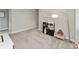 The playroom includes soft carpet, neutral paint, a modern style lamp, and a kitchen play set at 6917 Wolf Creek Ct, Whitestown, IN 46075
