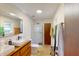 Modern bathroom with double sinks, walk-in shower, and tile floor at 741 Fairway Dr, Indianapolis, IN 46260