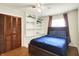 Charming bedroom boasts storage, soft lighting and hardwood floors at 741 Fairway Dr, Indianapolis, IN 46260