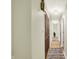 Bright hallway with neutral paint, wood flooring and large rug runner at 741 Fairway Dr, Indianapolis, IN 46260