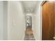 Hallway with multiple doors, carpet runner, and neutral paint at 741 Fairway Dr, Indianapolis, IN 46260