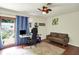 Office space with hardwood floors, ceiling fan, desk, and walk-out to backyard at 741 Fairway Dr, Indianapolis, IN 46260