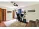 Office space with ceiling fan, hardwood floors, and walk-out to backyard at 741 Fairway Dr, Indianapolis, IN 46260