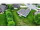 Aerial view of the backyard featuring a patio, and a green lawn at 7521 Kilbarron Cir, Indianapolis, IN 46217
