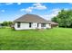 Spacious backyard with lush green grass, ideal for outdoor activities and relaxation at 7521 Kilbarron Cir, Indianapolis, IN 46217
