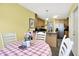 Eat-in kitchen area featuring natural light, table, and view into kitchen at 7521 Kilbarron Cir, Indianapolis, IN 46217