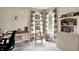 Bright home office features built-in shelving, a writing desk, and two sunny windows at 7521 Kilbarron Cir, Indianapolis, IN 46217