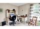 Functional home office with a built-in desk, comfortable seating, and a window for natural light at 7521 Kilbarron Cir, Indianapolis, IN 46217