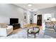 Bright living room with hardwood floors, neutral paint, and comfortable seating arrangement at 7521 Kilbarron Cir, Indianapolis, IN 46217