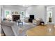 Inviting living room with hardwood floors, fireplace, neutral paint, and comfortable seating arrangement at 7521 Kilbarron Cir, Indianapolis, IN 46217