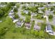 Scenic aerial view showcasing a neighborhood with lush lawns, mature trees, and well-maintained homes at 7724 Blackthorn Dr, Indianapolis, IN 46236