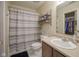 Neutral bathroom with a shower/tub combo, a closet, and a single sink vanity at 7724 Blackthorn Dr, Indianapolis, IN 46236
