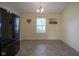 Bright dining area with tile flooring, a window and a modern chandelier at 7724 Blackthorn Dr, Indianapolis, IN 46236