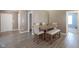 Dining room features hardwood floors and a modern table with seating for Gathering meals at 7724 Blackthorn Dr, Indianapolis, IN 46236
