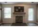 Close-up of the fireplace in the living room with decorative tile surround at 7724 Blackthorn Dr, Indianapolis, IN 46236