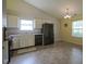 Bright kitchen features tile floors and modern appliances, perfect for cooking and dining at 7724 Blackthorn Dr, Indianapolis, IN 46236