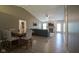 Open-concept living and dining area features hardwood floors, a fireplace, and comfortable furnishings at 7724 Blackthorn Dr, Indianapolis, IN 46236