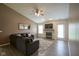 Cozy living room featuring a fireplace, large sectional sofa and wood-look floors at 7724 Blackthorn Dr, Indianapolis, IN 46236