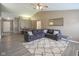 Spacious living room with vaulted ceiling, a large sectional sofa and wood-look flooring at 7724 Blackthorn Dr, Indianapolis, IN 46236