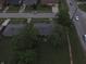 Aerial view of houses on a tree-lined street, showcasing a residential neighborhood layout and mature trees at 7929 Roy Rd, Indianapolis, IN 46219
