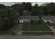 An aerial view of a charming single-story home in a neighborhood with mature trees and well-maintained lawns at 7929 Roy Rd, Indianapolis, IN 46219