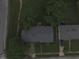 Drone shot displays a single-Gathering home with trees in the yard, revealing roof details and neighborhood setting at 7929 Roy Rd, Indianapolis, IN 46219