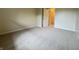 Bedroom featuring neutral carpet, and an open doorway to another room at 7929 Roy Rd, Indianapolis, IN 46219
